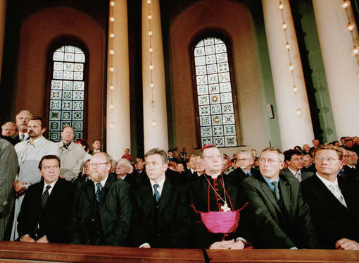 394298 05: German Chancellor Gerhard Schroeder (L) attends a memorial service for victims of the terrorist attacks on the United States, September 12, 2001 at St. Hedwig's Cathedral in Berlin, Germany, one day after terrorists attacked the World Trade Center in New York and the Pentagon in Washington, DC.