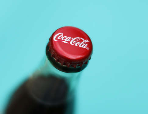A bottle of Coca-Cola is shown in this photo illustration in Encinitas, California October 10, 2013. The Coca-Cola Company will report  3rd quarter earnings October 15.    REUTERS/Mike Blake  (UNITED STATES - Tags: BUSINESS)  BEST QUALITY AVAILABLE - RTR3MC7E