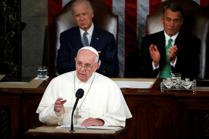 Pope Francis addresses a joint meeting of Congress on Capitol Hill in Washington, Thursday, Sept. 24, 2015, making history as the first pontiff to do so. Listening behind the pope are Vice President Joe Biden and House Speaker John Boehner of Ohio.