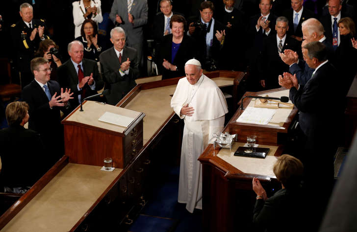 Speaker of the House John Boehner (R) and Vice President Joe Biden (R, top) applaud as Pope Francis arrives to give his speech to the U.S. Congress in Washington, September 24 2015.