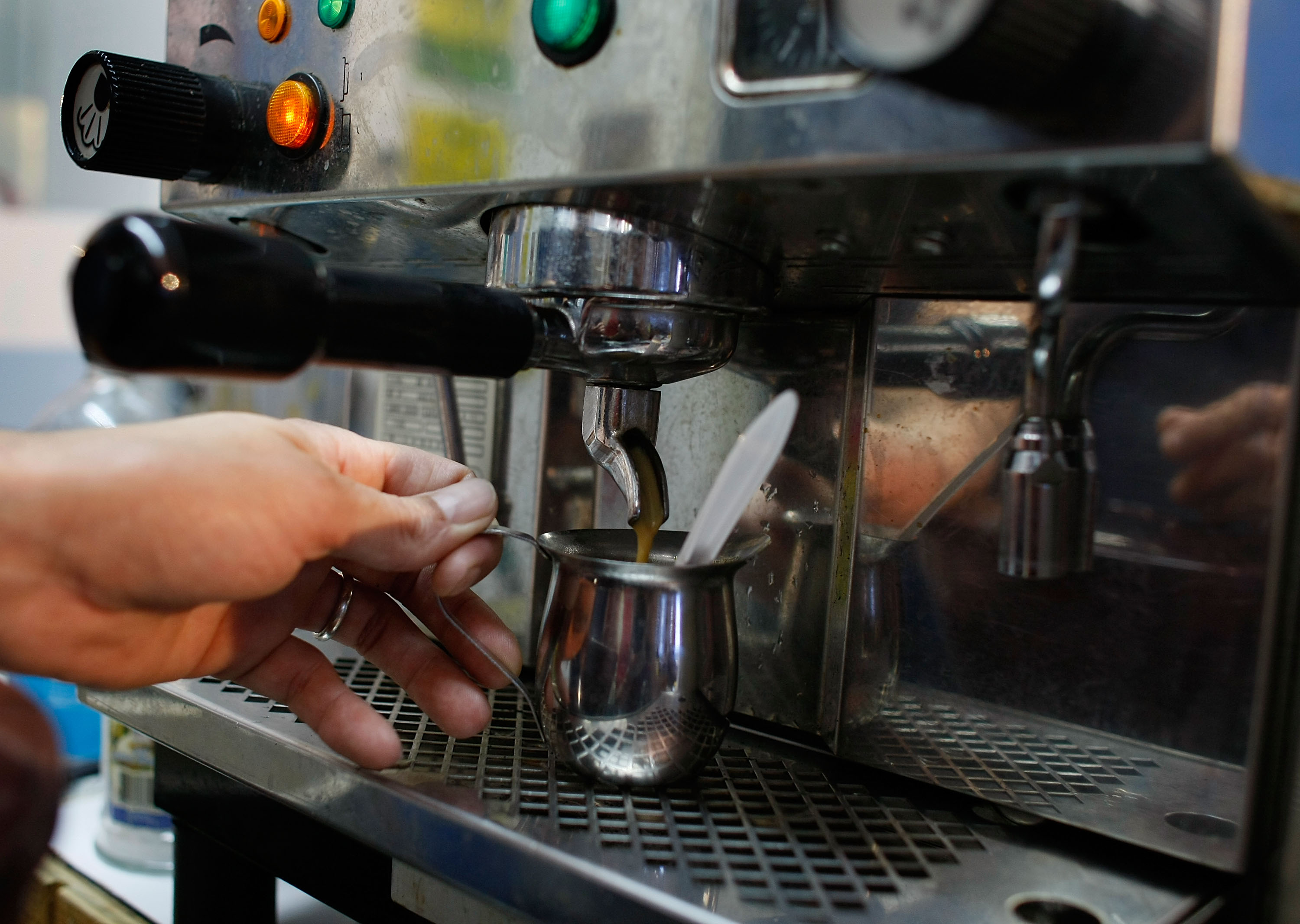 MIAMI - FEBRUARY 29: Javier De Armas pours an espresso at Red House Cafe February 29, 2008 in Miami, Florida. Today the price of coffee hit its highest level in a decade. Coffee futures for May delivery rose 3.4 cents, or 2.1%, to $1.675 a pound in New York.
