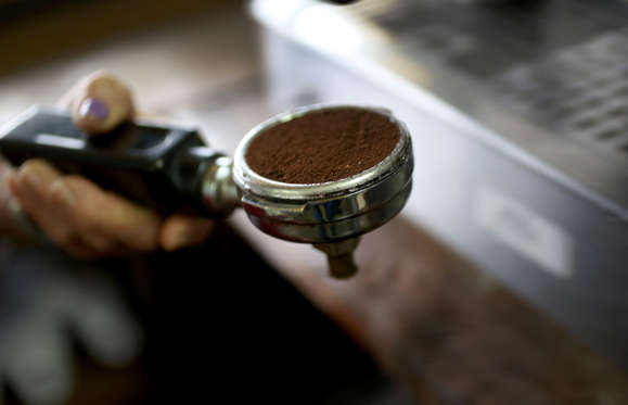 MIAMI, FL - MARCH 10: A scoop of coffee is seen as an expresso coffee is prepared for a customer at the Los Pinarenos Fruteria on March 10, 2015 in Miami, Florida. A panel of government-appointed scientists at the Dietary Guidelines Advisory Committee charged with proposing changes to U.S. dietary guidelines announced recently that three to five cups of coffee daily do not have long-term health risks, and help reduce the risk for heart disease and type 2 diabetes.