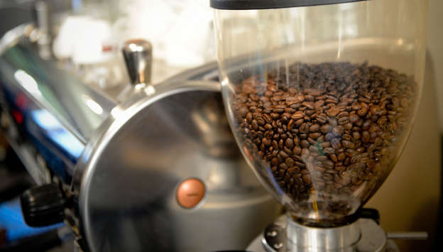 Coffee beans sit in a grinder during a class at the Barista Basics Coffee Academy in Sydney, Australia, on Monday, May 25, 2015. Once stereotyped as a land of meat pie-eaters and Foster's lager-swillers, Australia has developed a A$4 billion ($3.2 billion) coffee-drinking market that devours more fresh beans per person than any other country