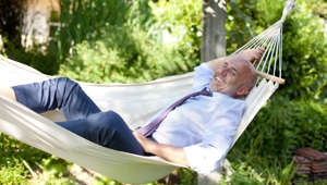 Businessman relaxing in hammock in a garden - Roman Märzinger/Westend61/Corbis 4-day work week trial found to decrease stress but not work output