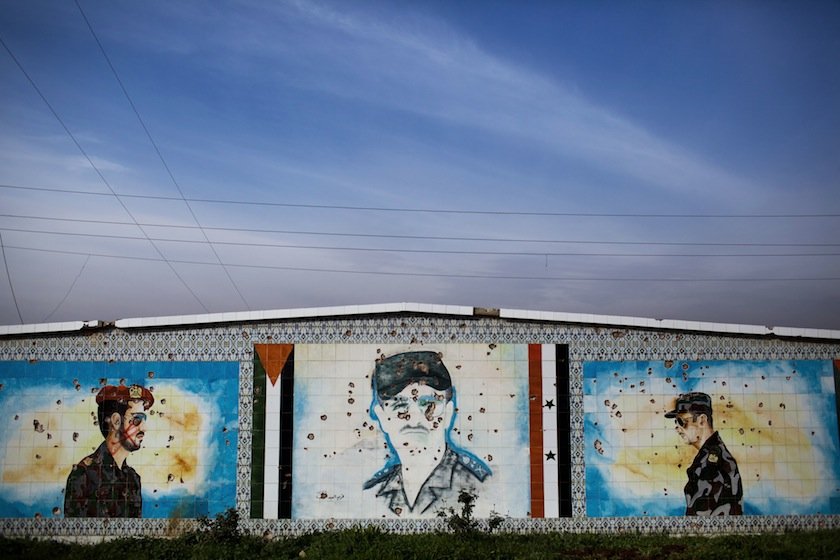 A mosaic of Hafez Assad after being shot at by FSA soldiers after heavy clashes with government forces in Tal Sheer, Syria, Dec 16, 2012.
