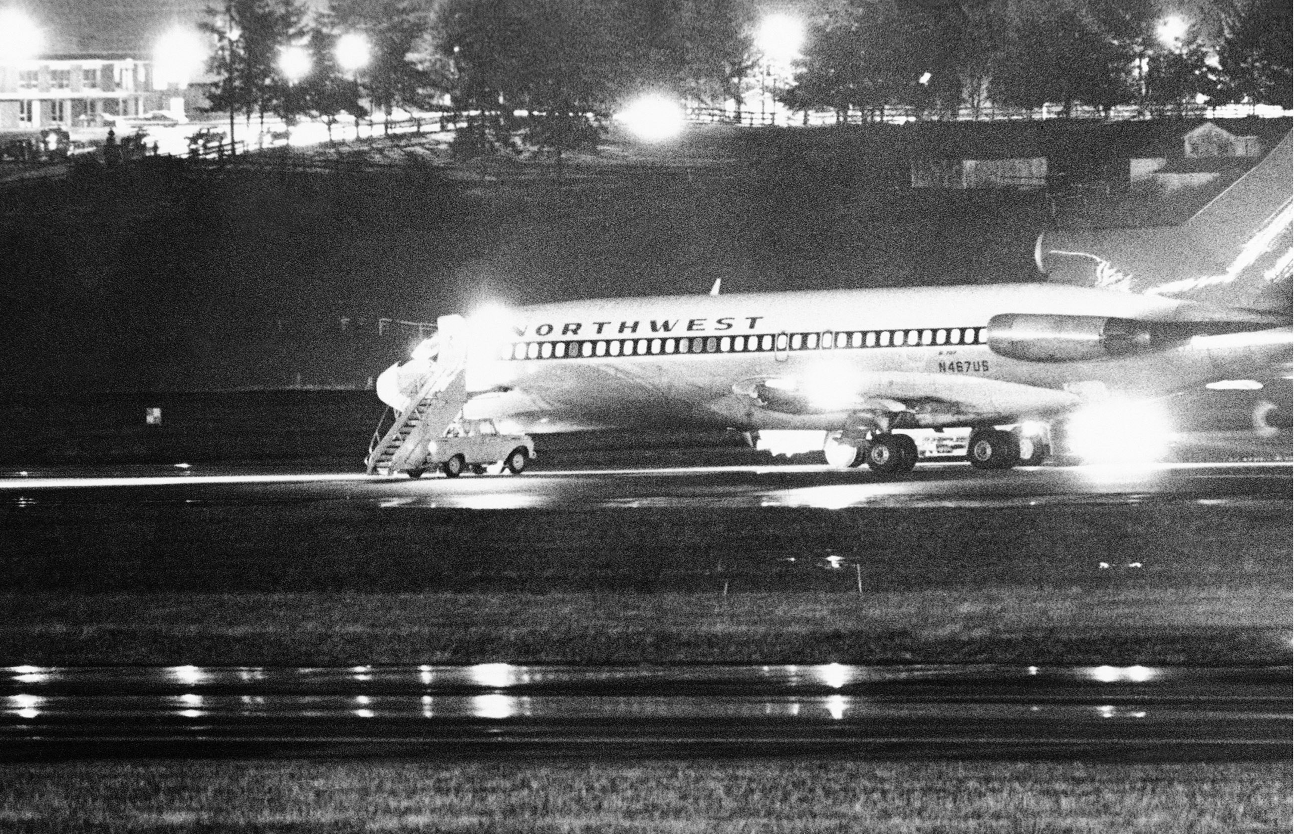 FILE -- A hijacked Northwest Airlines jetliner is seen in this Nov. 25, 1971 file photo as it sits on a runway for refueling at Seattle-Tacoma International Airport, Nov. 25, 1971, Seattle. 2011 has been a rich year for students of D.B. Cooper, the mysterious skyjacker who vanished out the back of the Boeing 727 wearing a business suit, a parachute and a pack with $200,000 in ransom money 40 years ago Thursday. (AP Photo, File)