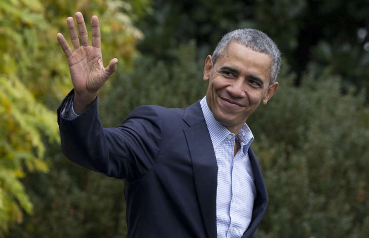 President Barack Obama waves as he walks across the South Lawn of the White House to board Marine One on Nov. 29, 2015, in Washington.