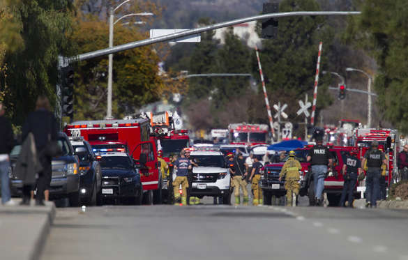 Police and fire personnel secure the scene of a mass shooting at the Inland Regional Center in San B... - Gina Ferazzi/Los Angeles Times/TNS Police and fire personnel secure the scene of a mass shooting at the Inland Regional Center in San Bernardino, Calif., on Wednesday, Dec. 2, 2015.