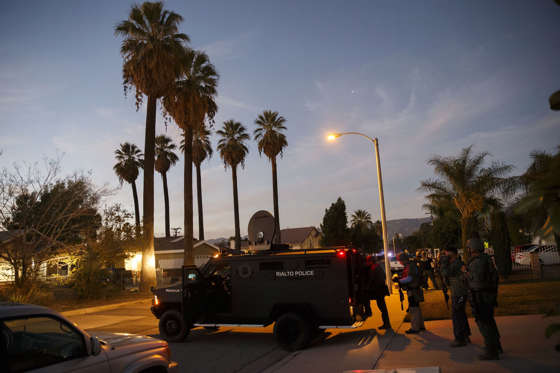 Law enforcement officers search for the suspects of a mass shooting Dec. 2, 2015 in San Bernardino, Calif.