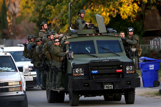 A SWAT team mobilizes on Gould Street near where suspects were shot following a mass shooting in San... - Marcus Yam/Los Angeles Times/TNS A SWAT team mobilizes on Gould Street near where suspects were shot following a mass shooting in San Bernardino, Calif., on Wednesday, Dec. 2, 2015.
