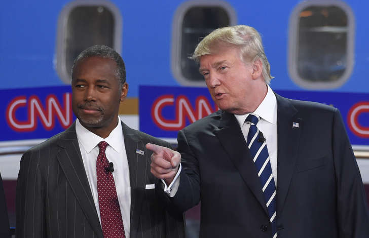 Republican presidential candidates Ben Carson, left, and Donald Trump talk before the start of the CNN Republican presidential debate at the Ronald Reagan Presidential Library and Museum on Sept. 16, 2015, in Simi Valley, Calif.