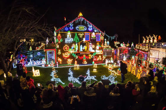 Crowds gather to see the Christmas lights at a house in Brentry, Bristol, where brothers Lee and Paul Brailsford illuminate their mother's house with thousands of festive bulbs and displays for charity.