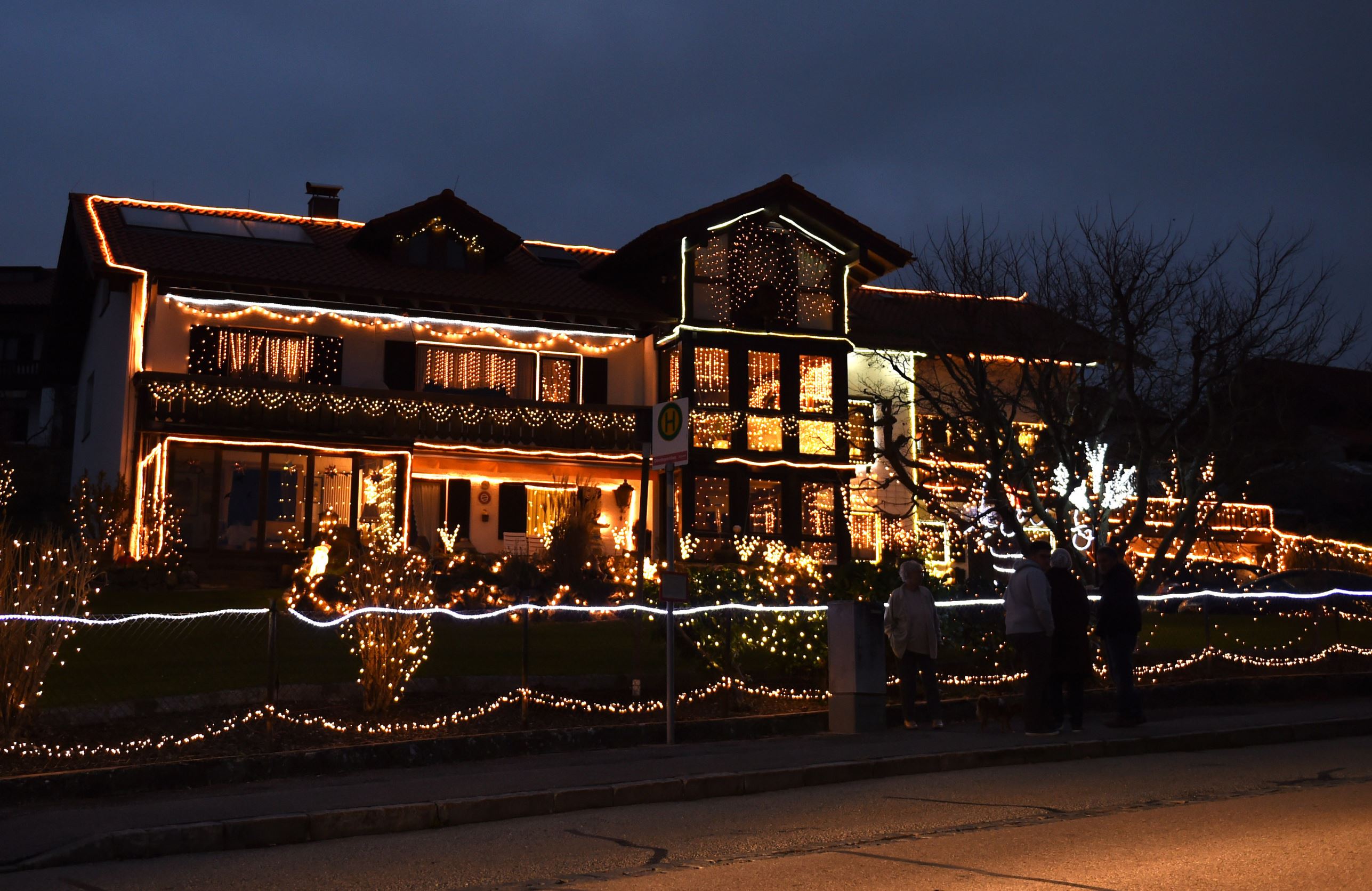 Christmas decoration illuminates a garden and a house in the small Bavarian town of Hoeslwang near Rosenheim, southern Germany, on December 2, 2015. More than 30.000 lights decorate house and garden during the Advent. AFP PHOTO / CHRISTOF STACHE / AFP / CHRISTOF STACHE (Photo credit should read CHRISTOF STACHE/AFP/Getty Images)