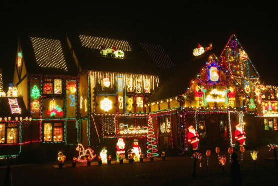 BERKSHIRE, ENGLAND - DECEMBER 10: A house covered in Christmas light and decorations on December 10, 2003 in Berkshire, England. The house is covered in Christmas light to help the Heart Fundation charity. (Photo by Graeme Robertson/Getty Images)