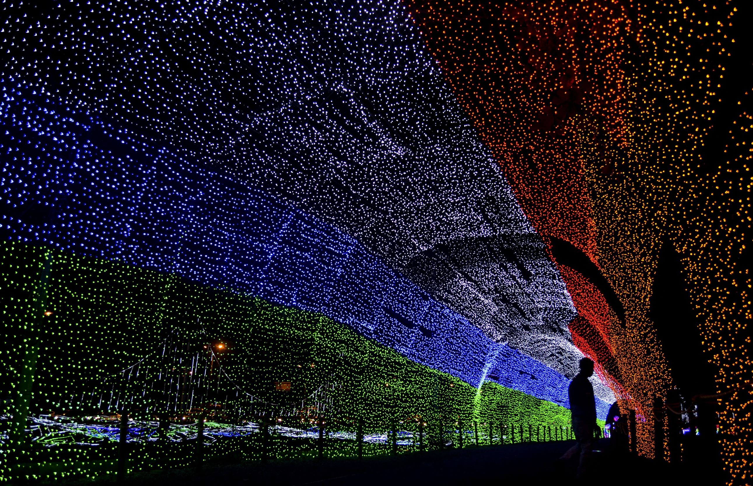 Christmas lights illuminate the Medellin River on December 9, 2014 in Medellin, Antioquia department, Colombia. AFP PHOTO/RAUL ARBOLEDA (Photo credit should read RAUL ARBOLEDA/AFP/Getty Images)