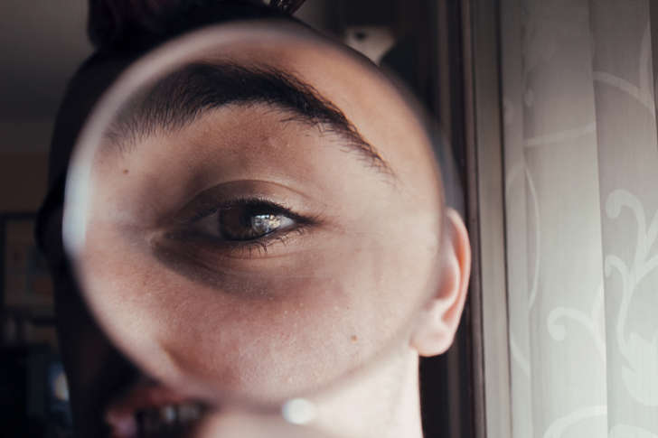 An eye through a magnifying glass