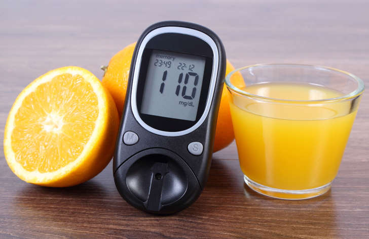Glucometer with oranges and juice