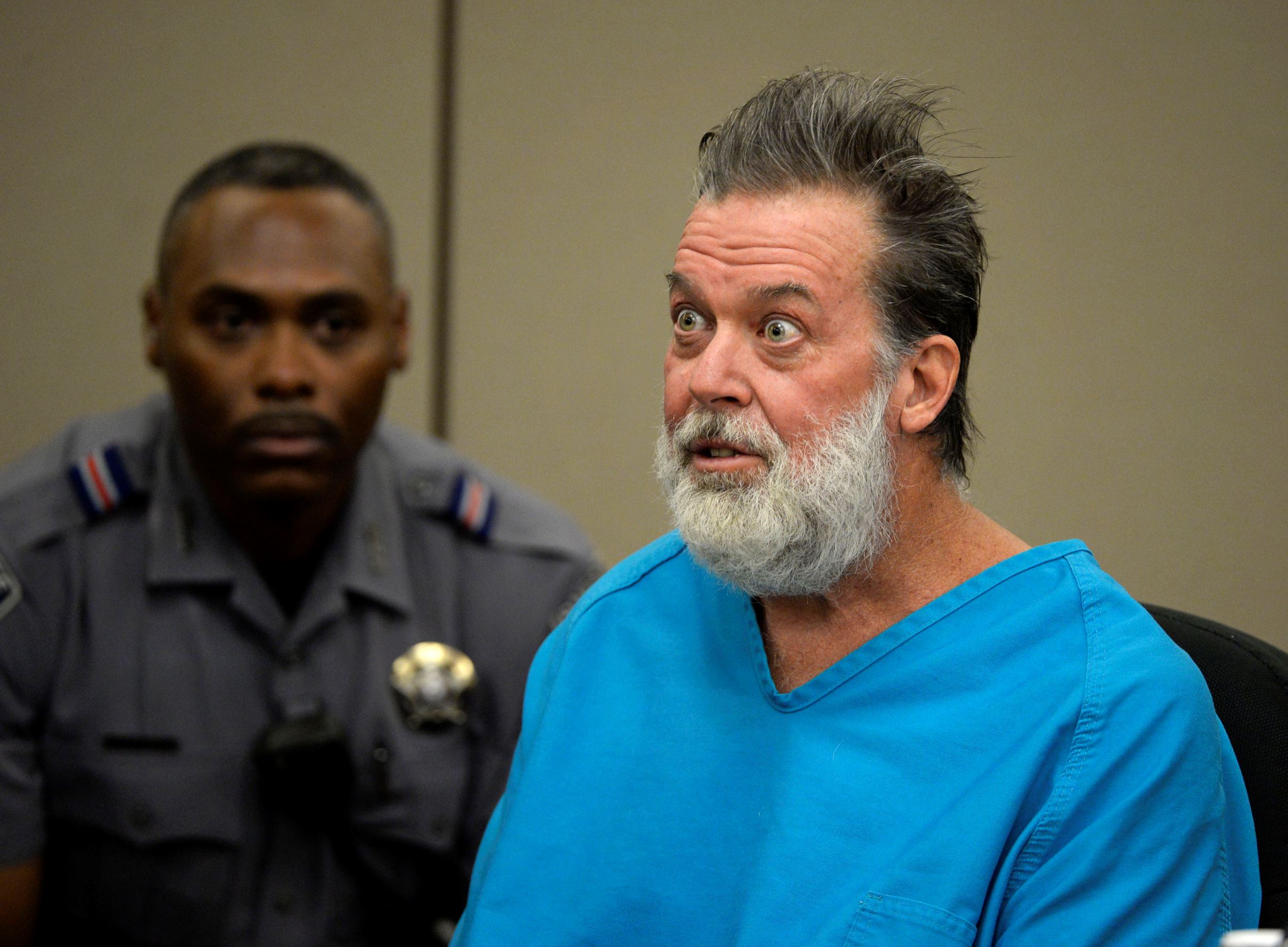 Robert Lewis Dear talks to Judge Gilbert Martinez during a court appearance on Wednesday, Dec. 9, 2015, in Colorado Springs, Colo. Dear, accused of killing three people and wounding nine others at a Colorado Springs Planned Parenthood clinic on Nov. 27, was charged with first-degree murder.