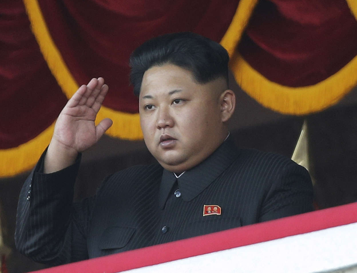 North Korean leader Kim Jong Un salutes at a parade in Pyongyang, North Korea.