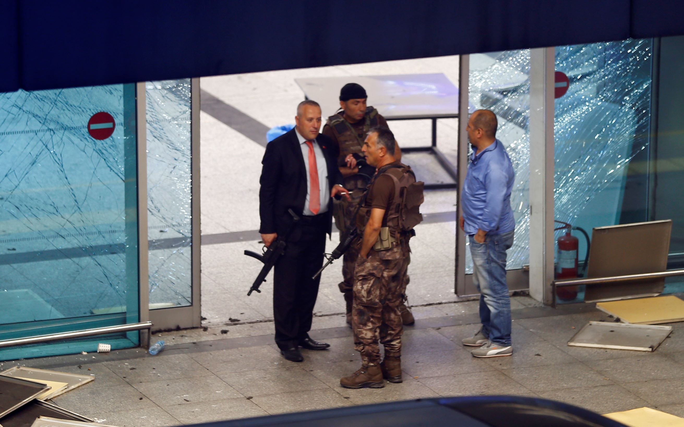 Armed security stand at an entrance of Turkey's largest airport, Istanbul Ataturk, Turkey, following a blast June 28, 2016. REUTERS/Osman Orsal TPX IMAGES OF THE