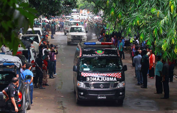 Ambulances carrying bodies head for hospitals after an operation against militants who took hostages at a restaurant popular with foreigners in Dhaka, Bangladesh, Saturday, July 2, 2016. Bangladeshi forces stormed the Holey Artisan Bakery in Dhaka's Gulshan area where heavily armed militants held dozens of people hostage Saturday morning, rescuing some captives including foreigners at the end of the 10-hour standoff. [AP Photo)