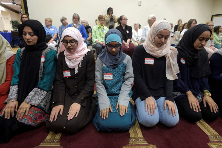 Non-Muslim members of the community watch a special prayer at the American Muslim Community Center Monday, June 13, 2016, in Longwood, Fla., after the mass-shooting at the Pulse Orlando nightclub.