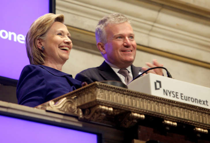 In this Sept. 21, 2009 file photo, then-Secretary of State Hillary Rodham Clinton, rings the New York Stock opening bell, accompanied by then-NYSE CEO Duncan L. Niederauer, in New York.