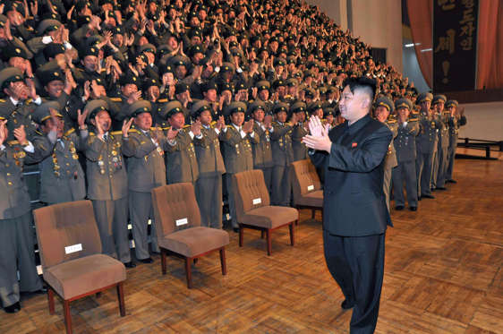 This undated picture released from North Korea's official Korean Central news Agency on November 27, 2012 shows North Korean leader Kim Jong-Un (R) during a photo session with participants in the national meeting of chiefs of branch social security stations at an undisclosed location in North Korea. AFP PHOTO / KCNA via KNS ---EDITORS NOTE--- RESTRICTED TO EDITORIAL USE - MANDATORY CREDIT 'AFP PHOTO / KCNA VIA KNS' - NO MARKETING NO ADVERTISING CAMPAIGNS - DISTRIBUTED AS A SERVICE TO CLIENTS (Photo credit should read KCNA VIA KNS/AFP/Getty Images)