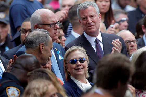 Hillary Clinton and New York Mayor Bill de Blasio attend the ceremonies.
