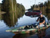 Eric Locklear paddles near a partially submerged vehicle on October 12, 2016 in Lumberton, North Carolina. Hurricane Matthew's heavy rains ended over the weekend, but flooding is still expected for days in North Carolina.