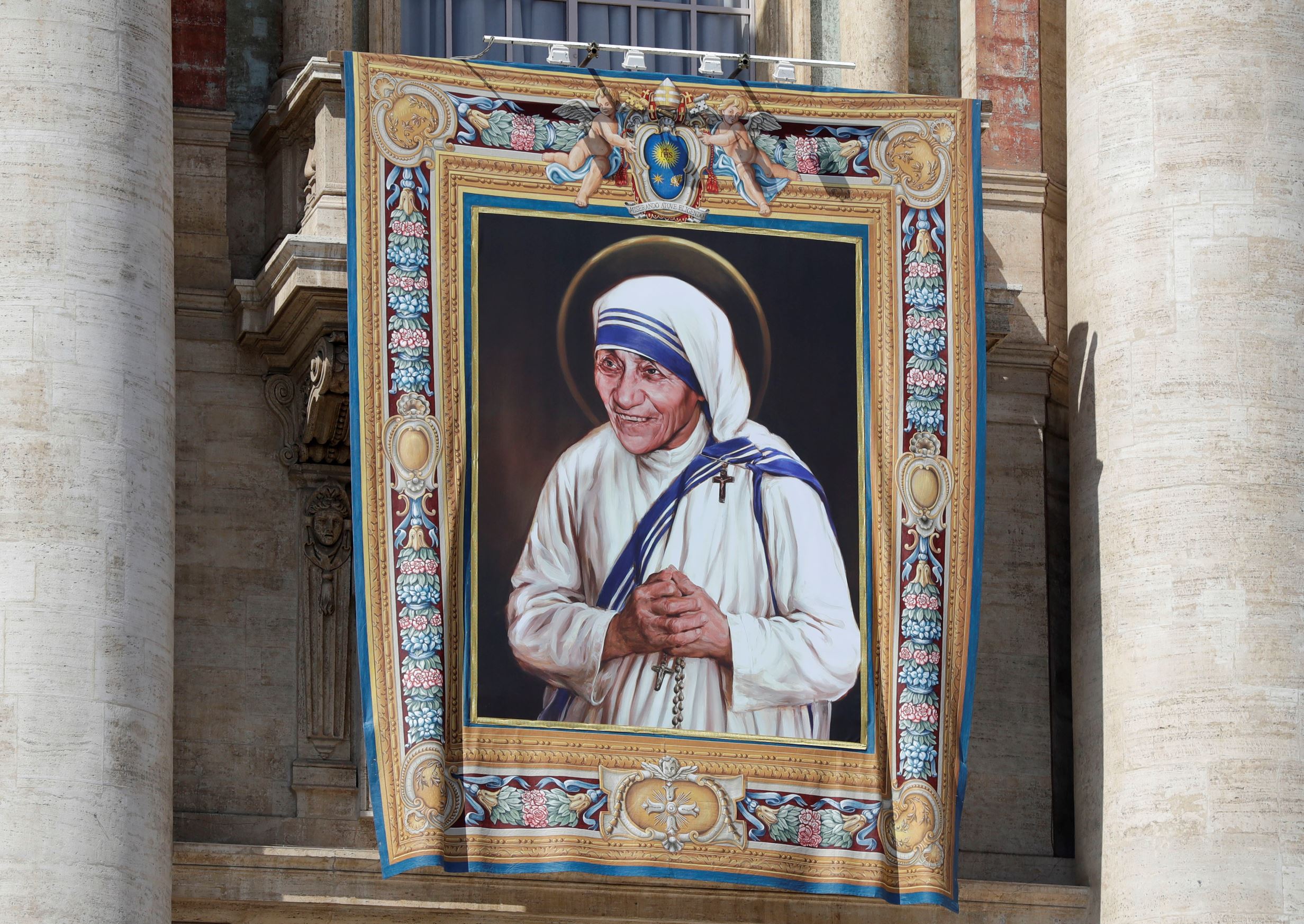 FILE - In this Thursday, Sept. 1, 2016 file photo, a tapestry showing Mother Teresa hangs from the central balcony of St. Peter's Basilica, in St. Peter's Square, at the Vatican.