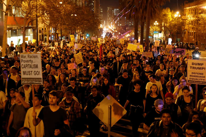 Demonstrators march on Market Street in San Francisco, California, U.S. following the election of Donald Trump as the president of the United States November 9, 2016.