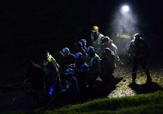 Rescue and forensic teams recover the bodies of victims of the LAMIA airlines charter that crashed in the mountains of Cerro Gordo, municipality of La Union, Colombia, on November 29, 2016 carrying members of the Brazilian football team Chapecoense Real.