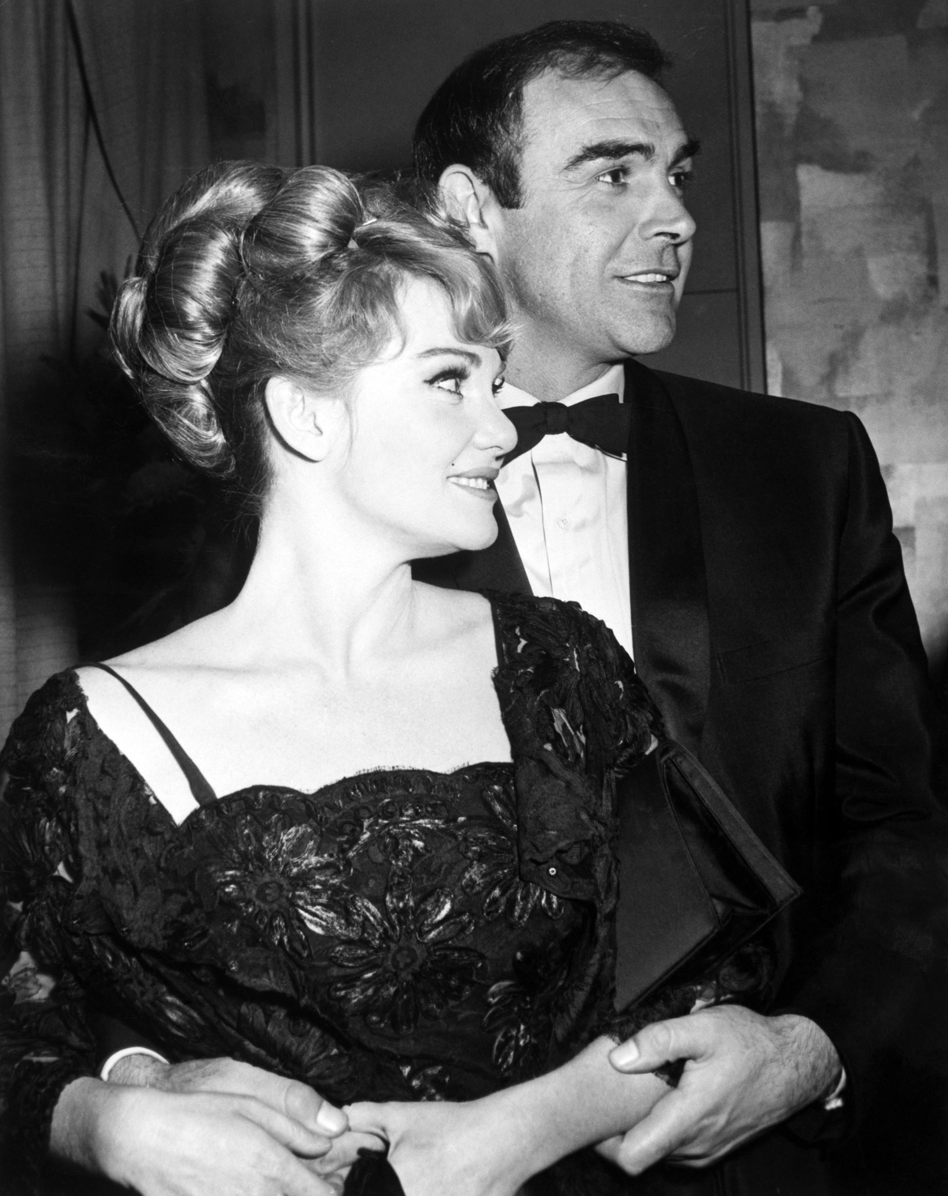 Diane Cilento and husband Sean Connery, better known to movie fans around the world as "007" James Bond. Diane is also an actress and claims she is not the least bit jealous of the exotic femmes her husband woos on-screen, just as long as she is number one offscreen- which she is. Ca. 1970s.