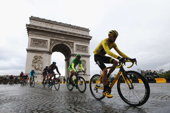 PARIS, FRANCE - JULY 26:  Chris Froome (yellow jersey) of Great Britain and Team Sky rides past the Arc de Triomphe on his way to overall victory during the twenty first stage of the 2015 Tour de France, a 109.5 km stage between Sevres and Paris Champs-E