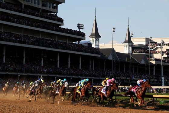 LOUISVILLE, KY - MAY 02:  The field races through turn one at the start of the 141st running of the Kentucky Derby at Churchill Downs on May 2, 2015 in Louisville, Kentucky.  (Photo by Chris Graythen/Getty Images)