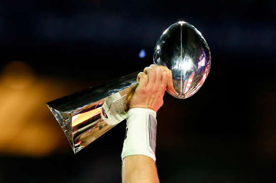 GLENDALE, AZ - FEBRUARY 01:  Tom Brady #12 of the New England Patriots celebrates holding the Vince Lombardi Trophy after defeating the Seattle Seahawks during Super Bowl XLIX at University of Phoenix Stadium on February 1, 2015 in Glendale, Arizona. The