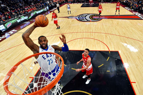 TORONTO, ON - FEBRUARY 14: LeBron James #23 of the Cleveland Cavaliers and the Eastern Conference goes up for a dunk in the first half against Stephen Curry #30 of the Golden State Warriors and the Western Conference during the NBA All-Star Game 2016 at 