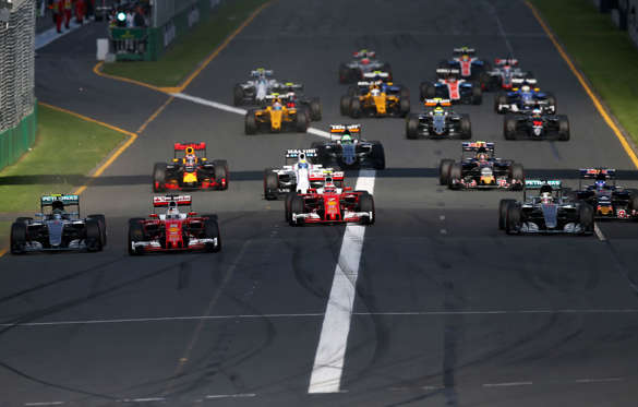 MELBOURNE, AUSTRALIA - MARCH 20:  Sebastian Vettel of Germany and Ferrari leads Nico Rosberg of Germany and Mercedes GP, Kimi Raikkonen of Finland and Ferrari and Lewis Hamilton of Great Britain and Mercedes GP into the first corner during the Australian
