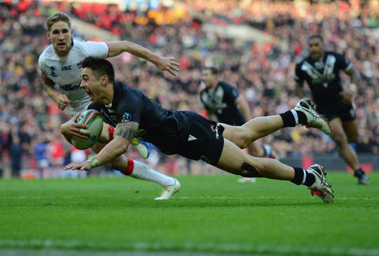 LONDON, ENGLAND - NOVEMBER 23:  Shaun Johnson of New Zealand scores the winning try during the Rugby League World Cup Semi Final match between New Zealand and England at Wembley Stadium on November 23, 2013 in London, England.  (Photo by Jamie McDonald/G