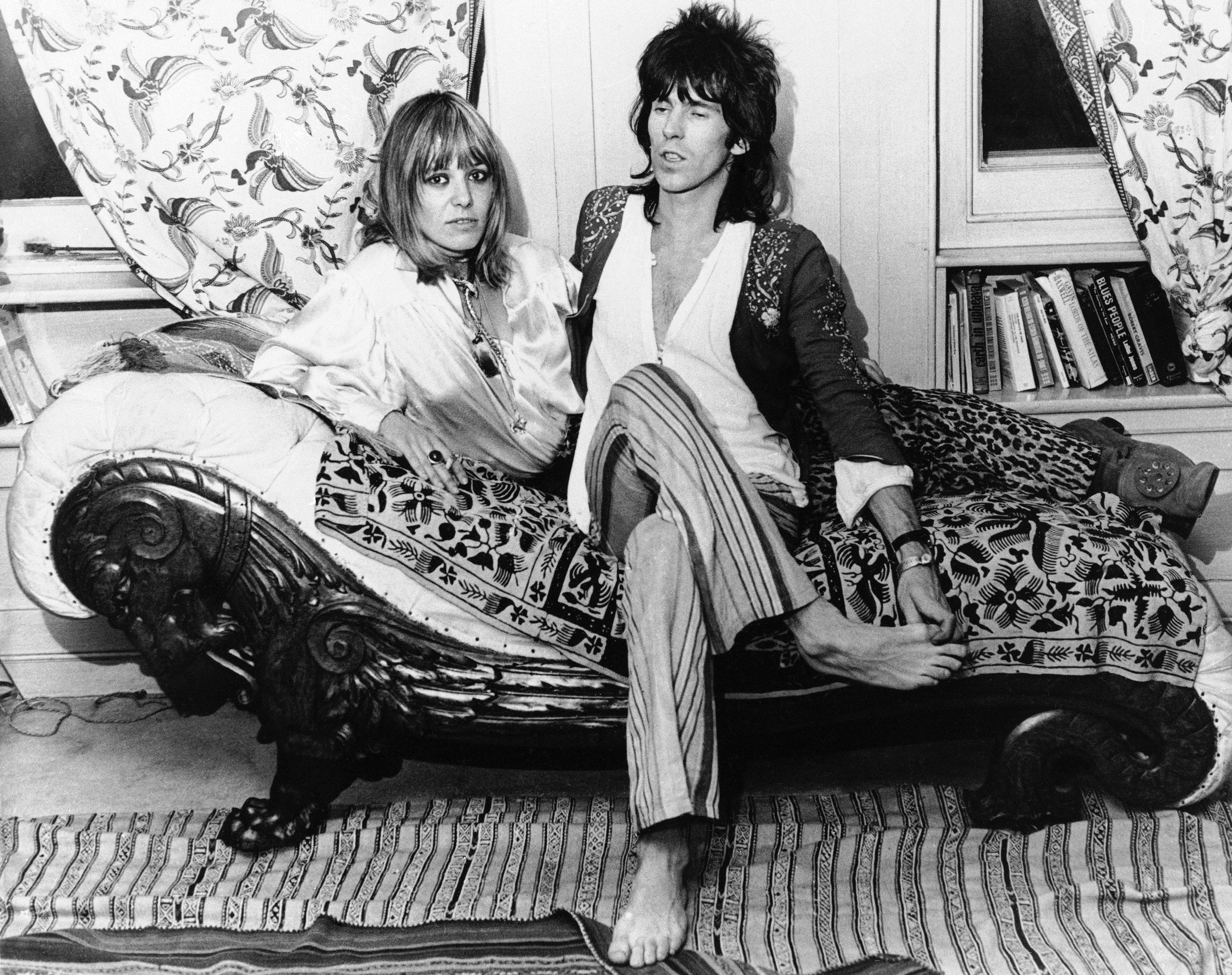 Keith Richards of the Rolling Stones rock group and his German girlfriend Anita Pallenberg relax at his home in London, Dec. 8, 1969, after he flew in from the U.S. where the group had been on tour. Miss Pallenberg complained that the British government had ordered her to marry Richards or get out of the country. The Home Office, which is responsible for deciding such things, said "We cannot understand this complaint. We have informed Miss Pallenberg that her permit to stay in this country has been extended until next October. The usual steps were taken to inform her."
