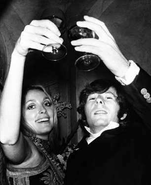 FILE - In this Feb. 18, 1969 file photo, Roman Polanski is shown with his wife, the actress Sharon Tate, toasting the opening of "Rosemary's Baby" in London. A topless photo of Polanski and Tate, taken just months before her death has sold at a New York City auction for $11,250. Christie's says it was sold Monday Dec. 7, 2009 to an unidentified private buyer.