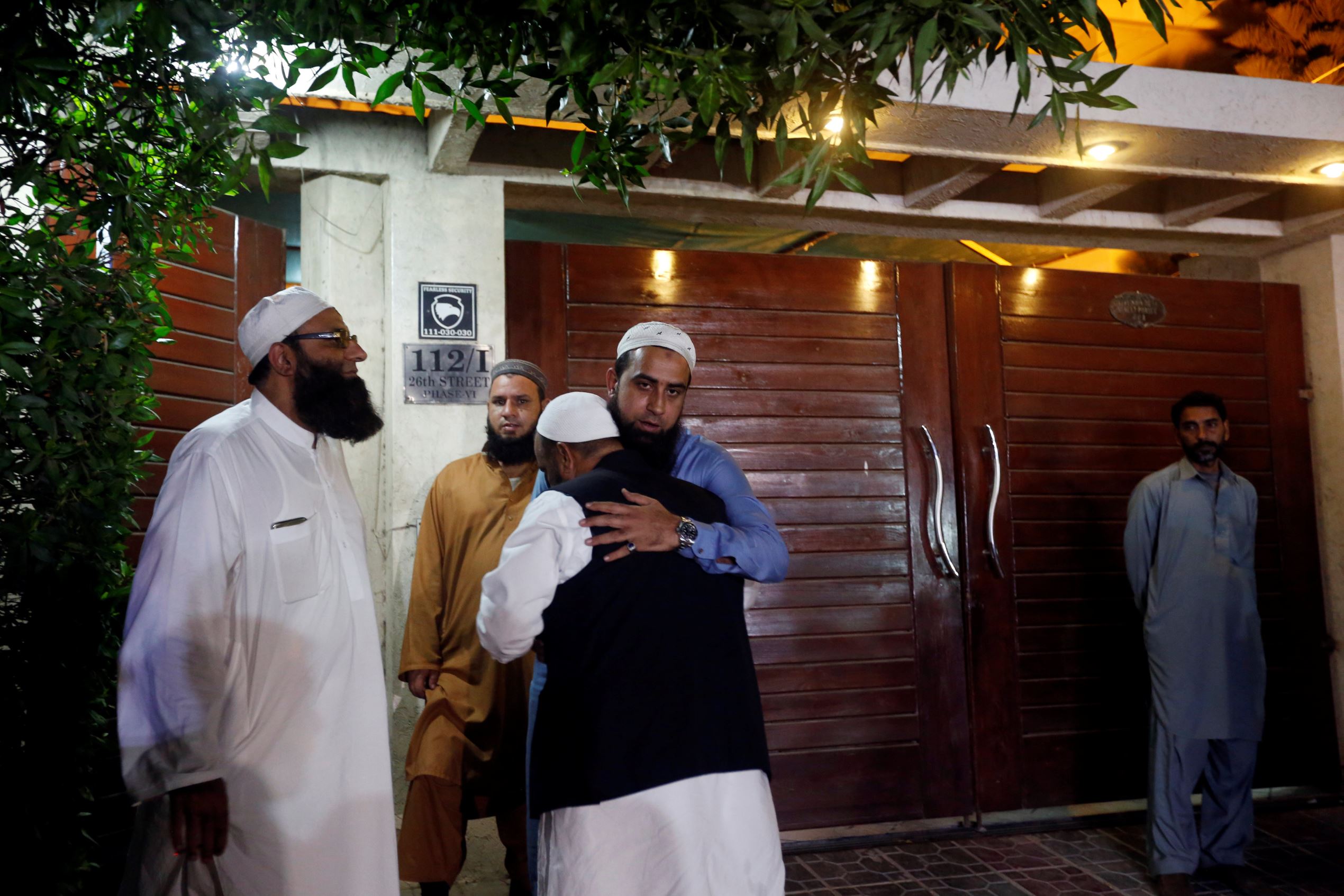 Relatives gather outside the residence of Junaid Jamshed, pop star turned evangelical Muslim cleric, in Karachi, Pakistan December 7, 2016.