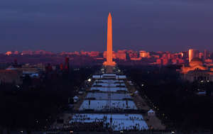 The sun rises at the Washington Monument as people gather on the National Mall on Inauguration Day on January 20, 2017 in Washington, DC. Donald J. Trump will become the 45th president of the United States today.