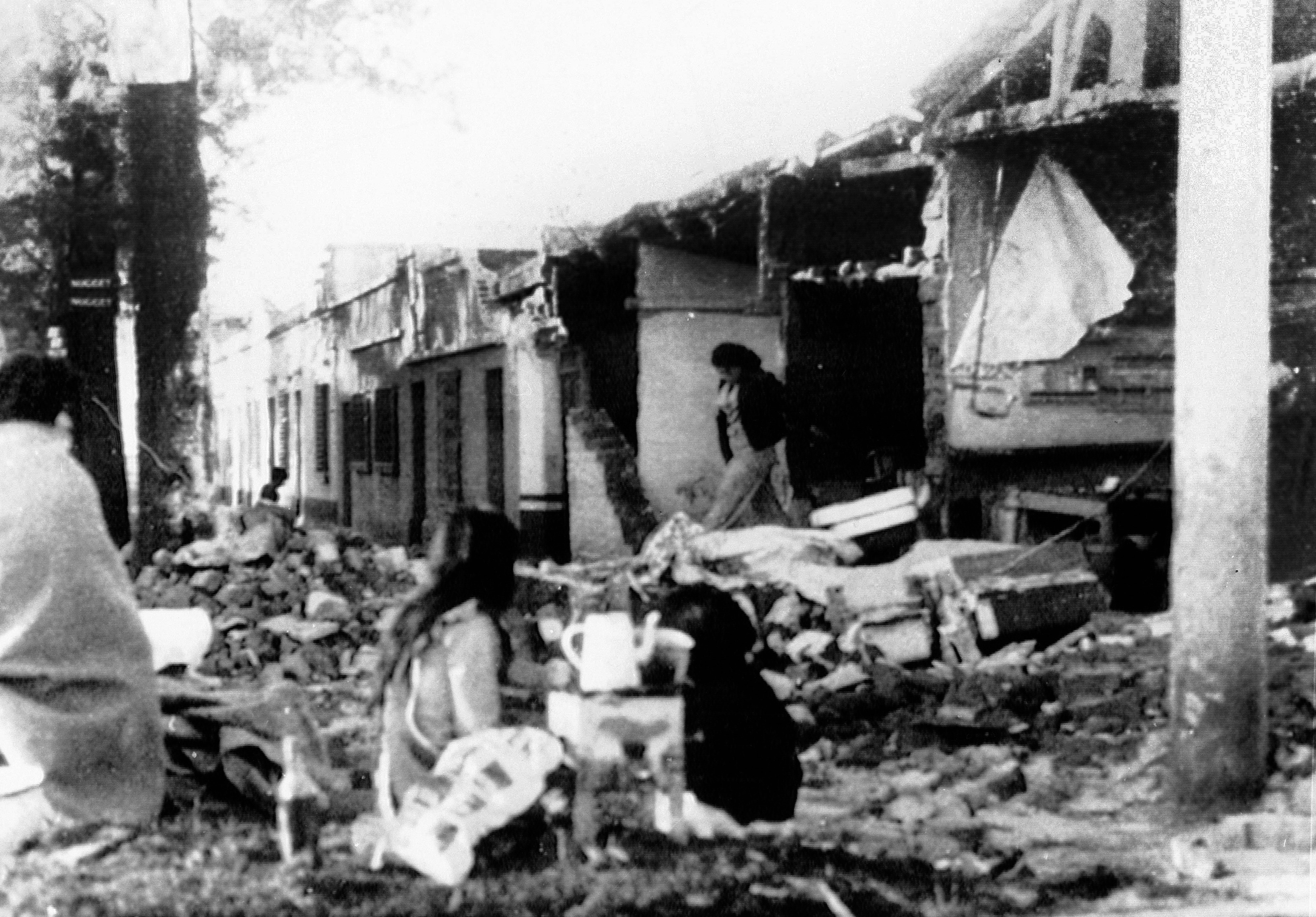 Slide 9 of 15: Refugees huddle in the street, in Guatemala City, on Feb. 4, 1976, after a major earthquake struck the capitol killing an estimated two thousand people.