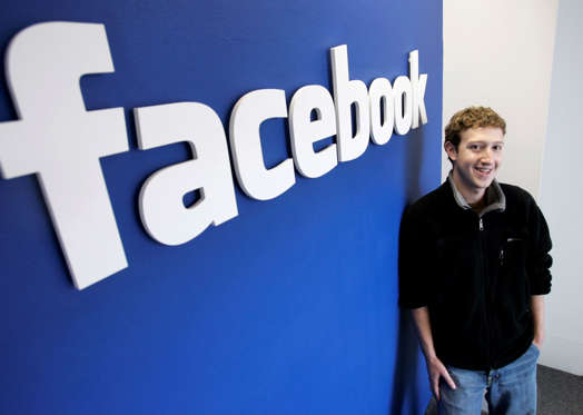 Slide 13 of 15: **ADVANCE FOR WEEKEND FEB. 24-25** Facebook.com's mastermind, Mark Zuckerberg smiles at his office in Palo Alto, Calif., Monday, Feb. 5, 2007. He is sitting on a potential gold mine that could make him the next Silicon Valley whiz kid to strike it rich. But the 22-year-old founder of the Internet's second largest social-networking site also could turn into the next poster boy for missed opportunities if he waits too long to cash in on Facebook Inc., which is expected to generate revenue of more than $100 million this year. The bright outlook is one reason Zuckerberg felt justified spurning several takeover bids last year, including a $1 billion offer from Yahoo Inc.