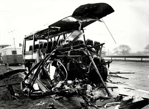 Slide 8 of 15: February 1974 The Wreckage Of The Coach After Bomb Exploded As Coach Was Travelling Along The M62 Motorway In Yorkshire En-route To Catterick Army Camp.