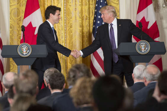 Slide 2 of 19: Donald Trump and Justin Trudeau shake hands during a joint press conference in the East Room of the White House in Washington. The Prime Minister and President met in Washington Feb. 13, 2017. It was the first time the two had met in person as leaders.