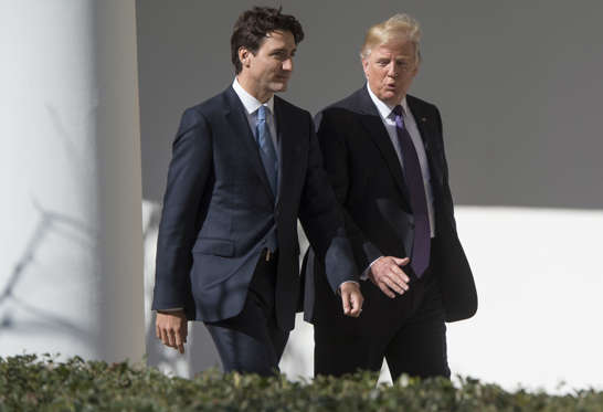 Slide 4 of 19: <p>U.S. President Donald Trump and Canadian Prime Minister Justin Trudeau walk down the West Wing Colonnade between meetings at the White House in Washington, Feb. 13, 2017.</p>
