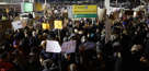 People gather for a protest at Terminal 4 of John F. Kennedy Airport, after people arriving from Muslim countries were detained at border control as a result of policies enacted by President Donald J. Trump, in New York, 28 January 2017.